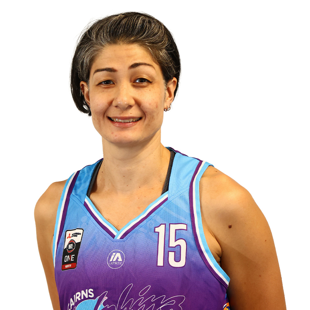 Smiling female basketball player in a sleeveless purple gradient jersey with the number 15 and team patches on the chest area.