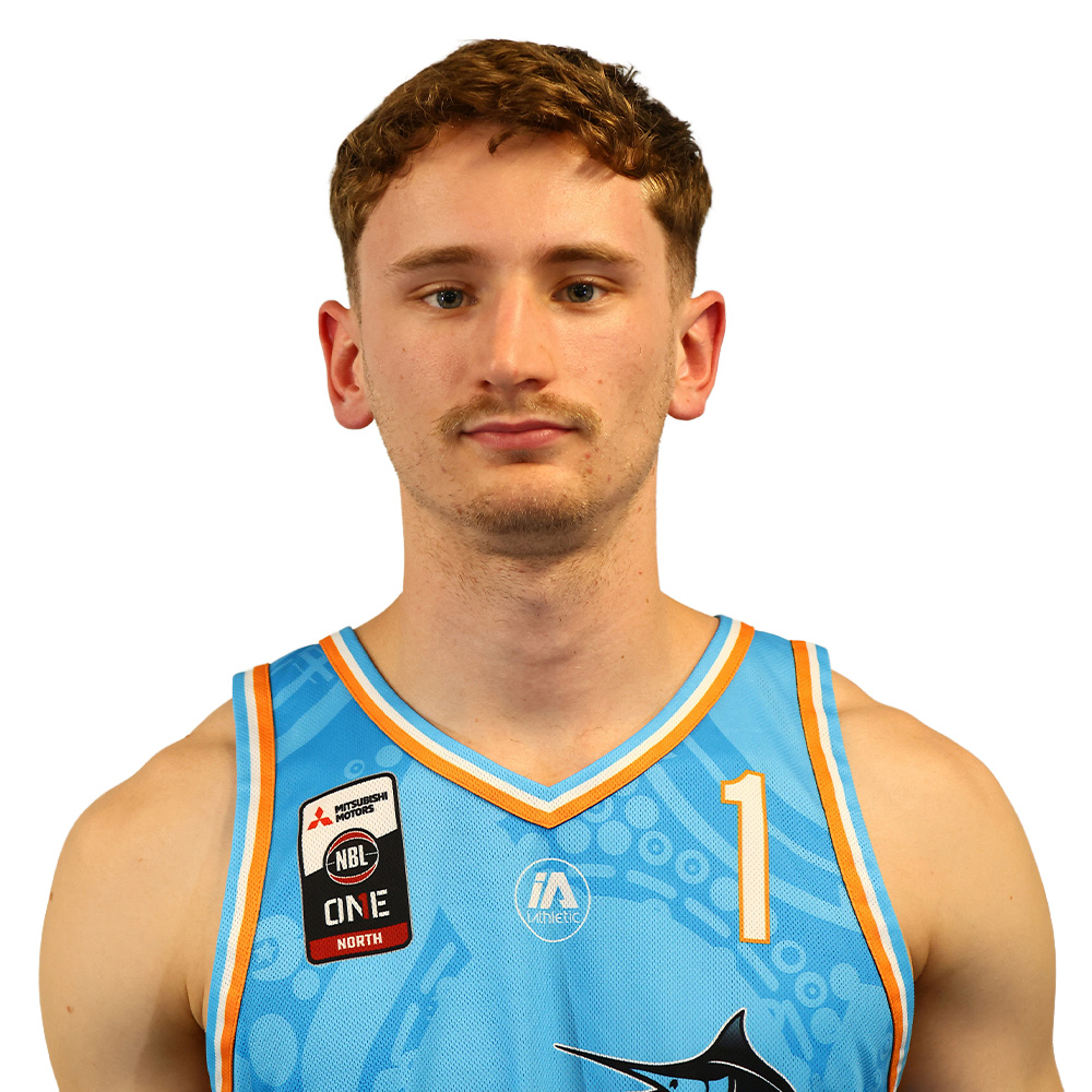 Portrait of a male basketball player facing the camera, wearing a light blue jersey with number 1 and team patches.