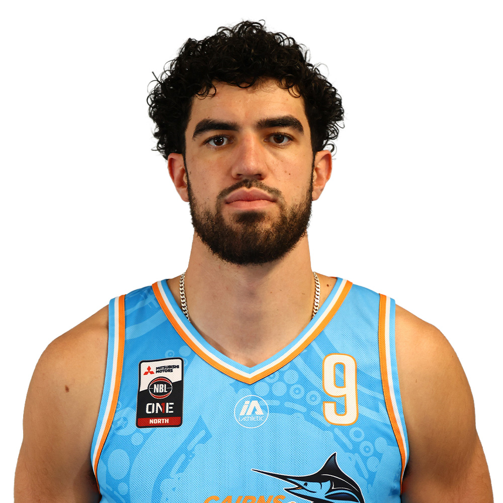 Male basketball player with dark curly hair and beard, wearing a light blue jersey with number 9, facing the camera.