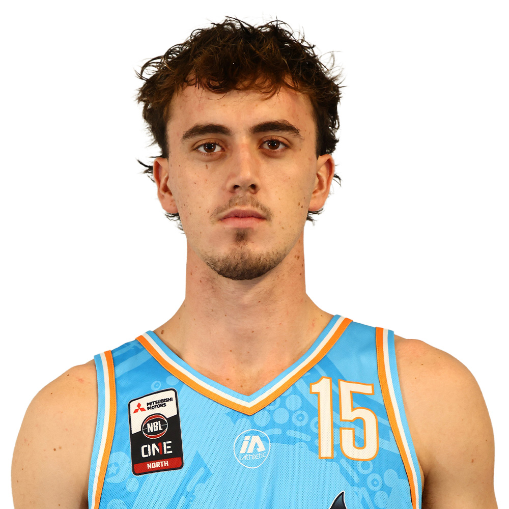 Portrait of a young man in a light blue basketball jersey with the number 15, facing the camera.