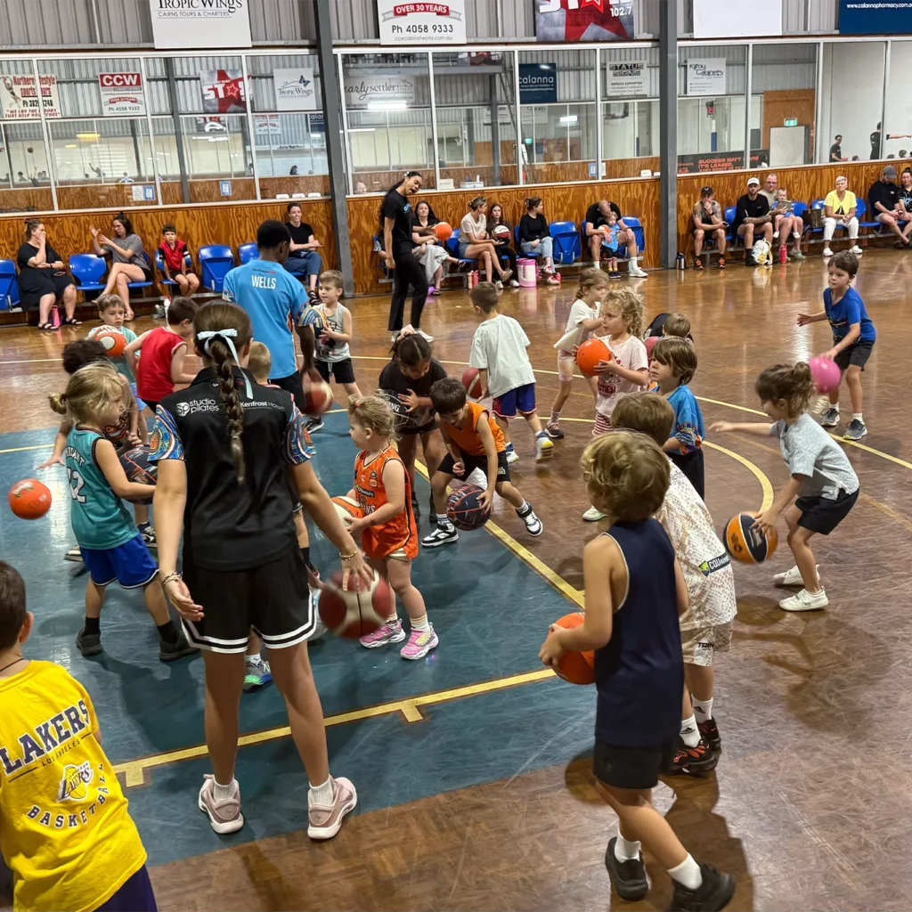 mini marlins and mini dolphins playing basketball