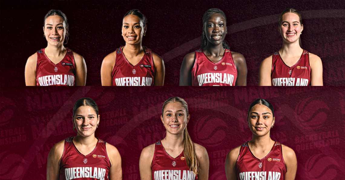 Group portrait of seven female Queensland basketball players in maroon uniforms, arranged in two rows.